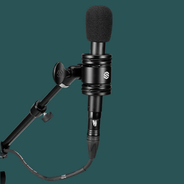 Sterling SL230MP Condenser Microphone on green background ready to record.