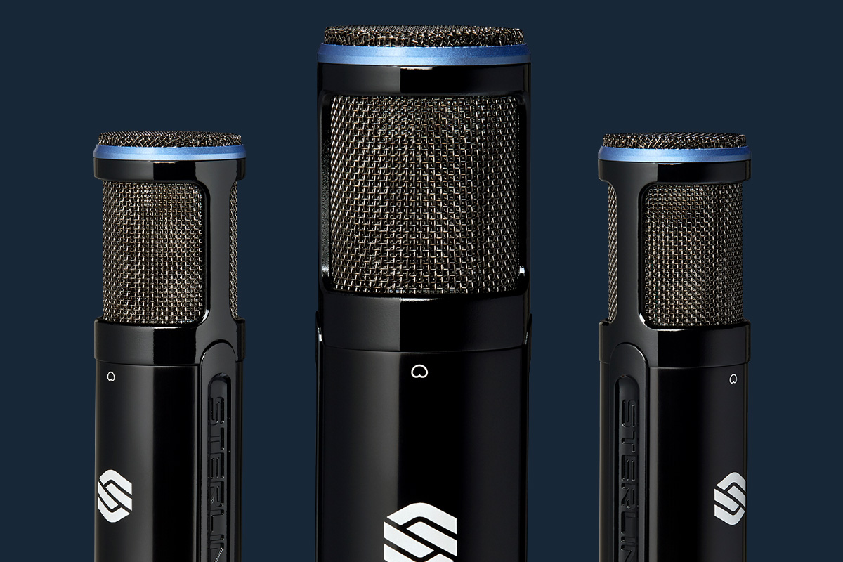 2 Sterling SP150SMK studio condenser microphones on blue background