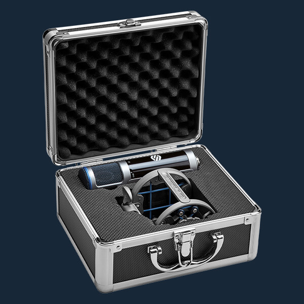 Sterling ST155 large diaphragm condenser microphone open case on blue background.