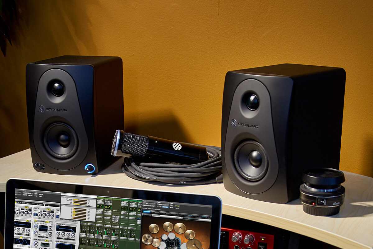 Sterling Audio MX3 3-inch powered studio monitor pair front on desk.