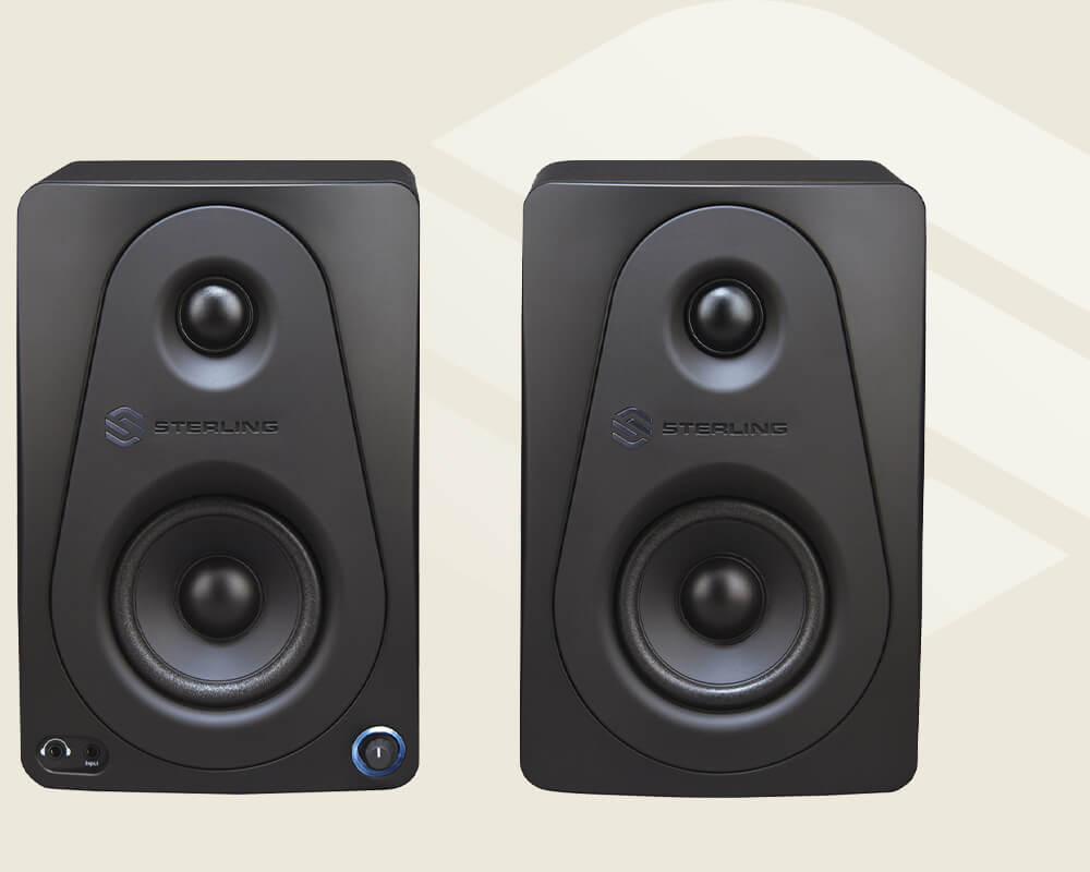 Sterling Audio MX3 3-inch powered studio monitor pair on light background.
