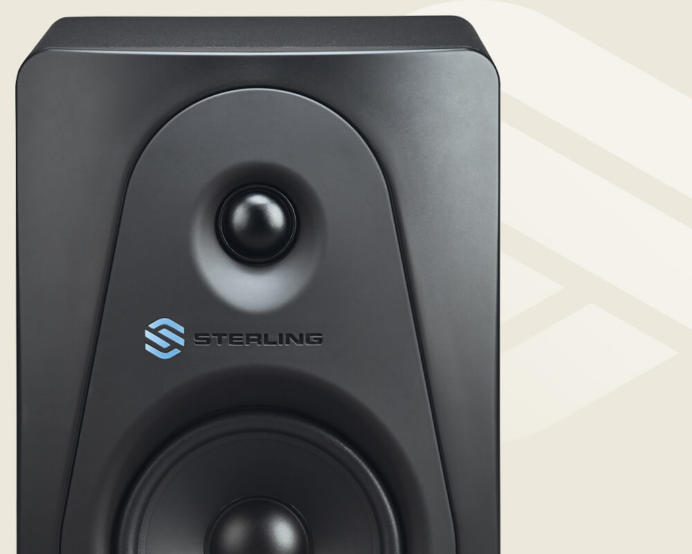 Sterling MX5 5-inch powered studio monitor left on a light background with Sterling logo.