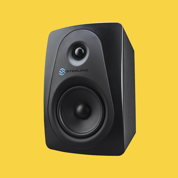 Sterling MX5 5-inch powered studio monitor left on yellow background.