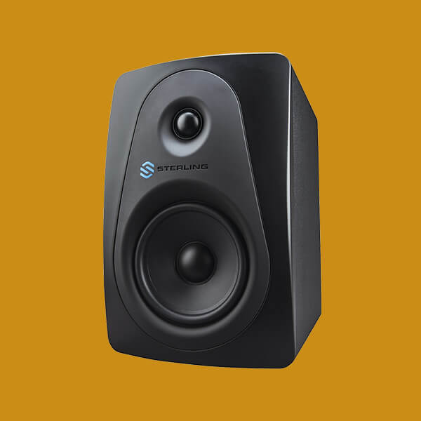 Sterling MX5 5-inch powered studio monitor left on yellow background.