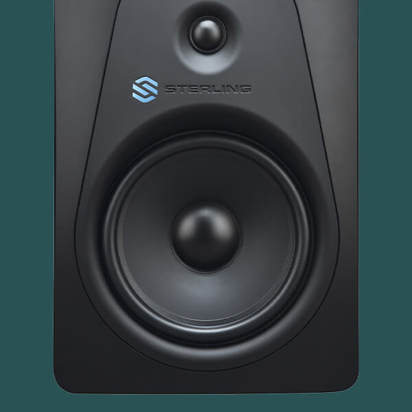 Sterling MX8 8-inch powered studio monitor front on green background.