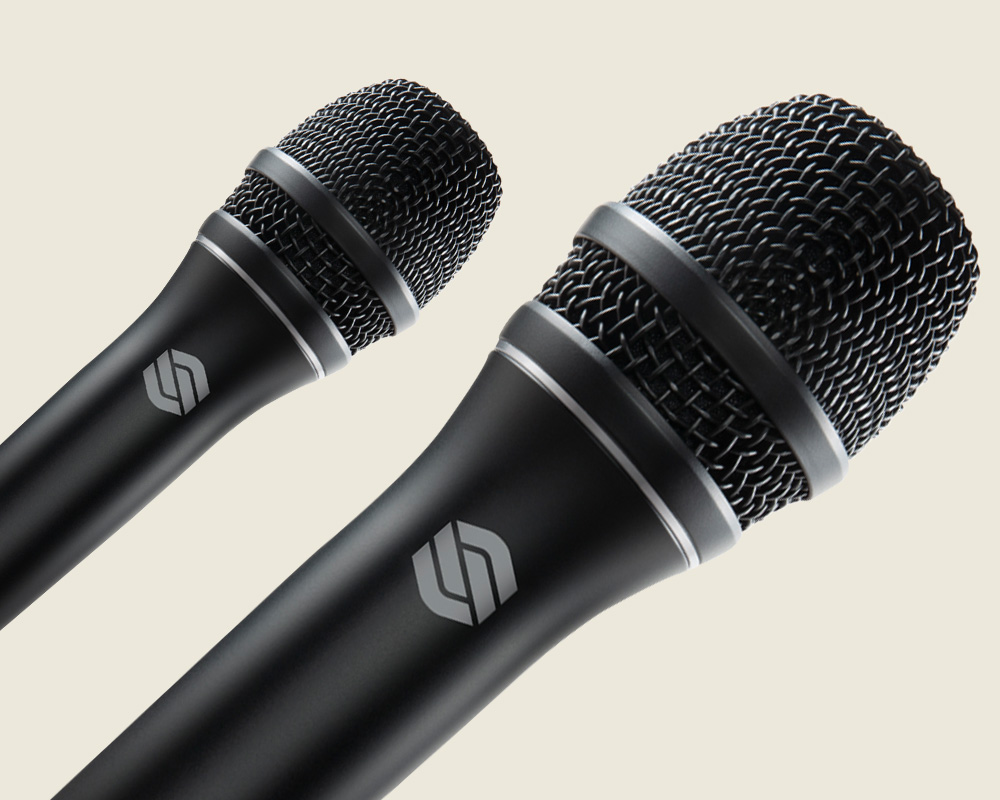 Two Sterling P30 active dynamic vocal microphones on light background.