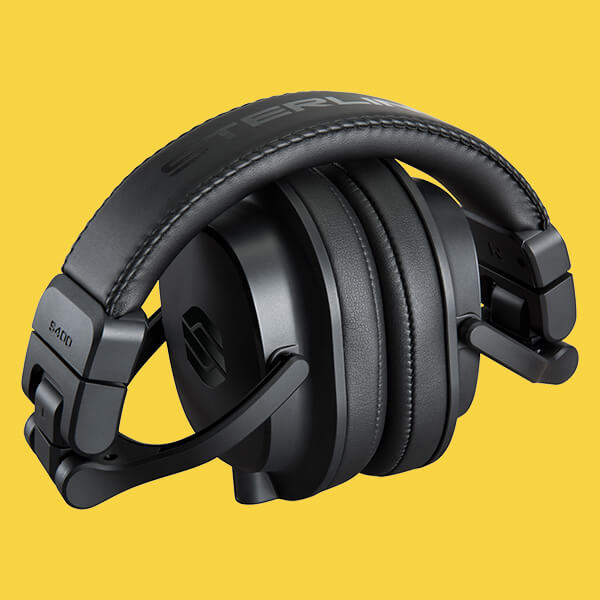 Sterling Audio S400 studio headphone folded on yellow background.