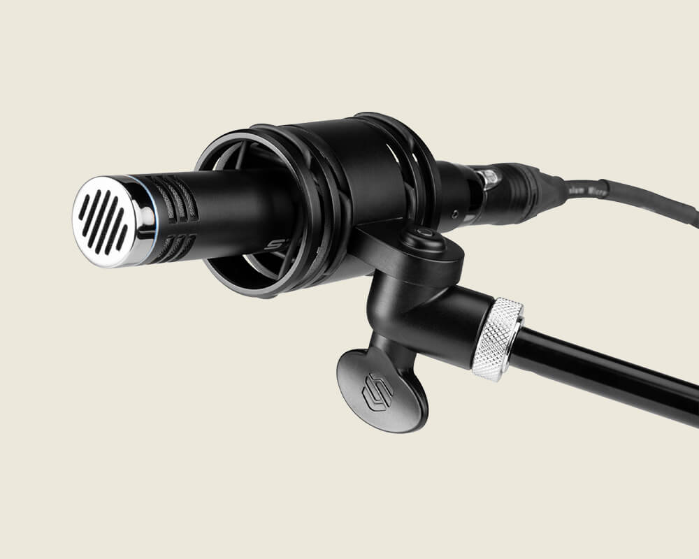 Sterling SL230MP Condenser Microphone Angled on a light background.