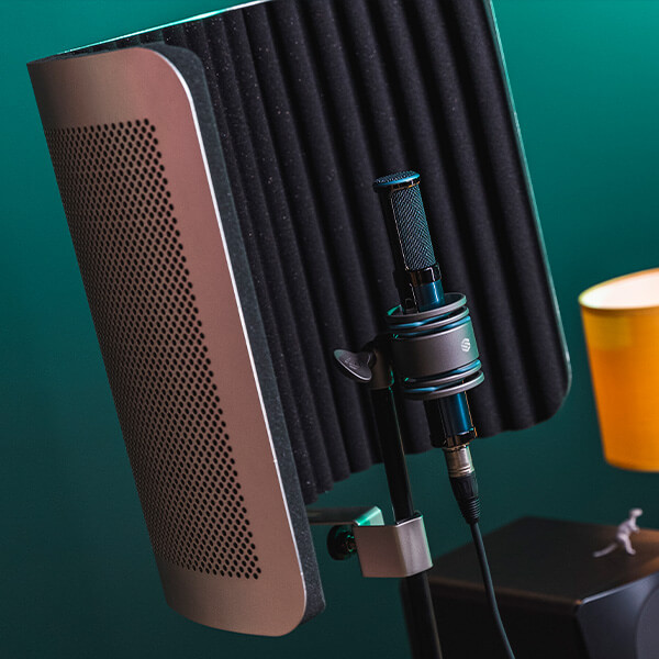 Sterling VMS vocal microphone shield front in green lit studio angled.