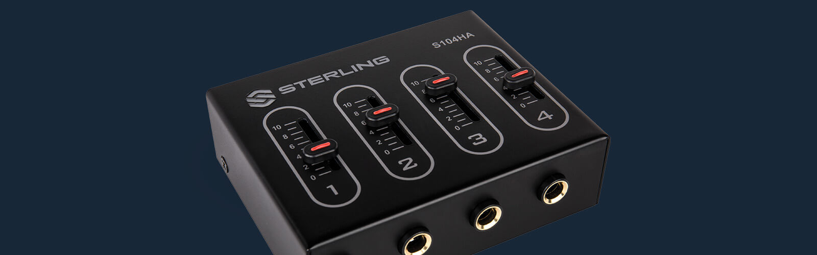 Sterling S104HA compact 4-channel headphone amplifier right on blue background close up.