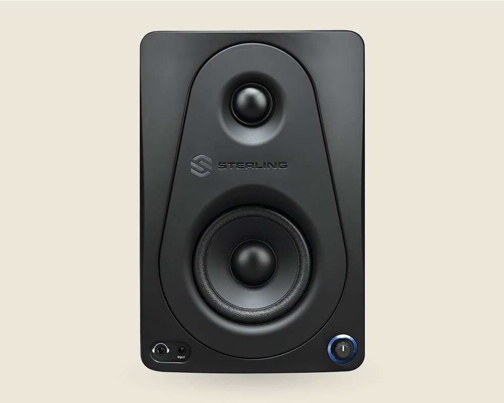 Sterling MX3 3-inch powered studio monitor pair left unit front on light background.