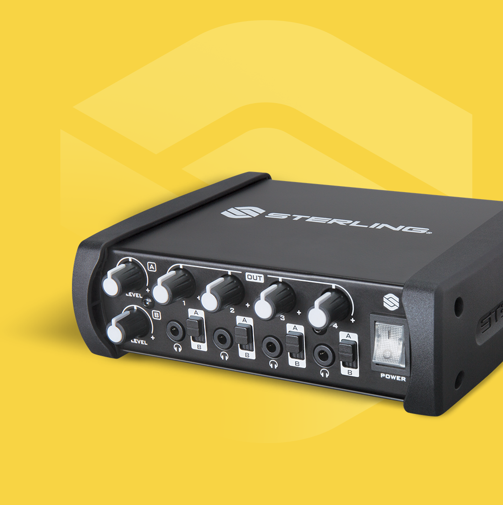 Sterling SHA4 4-channel desktop headphone amplifier on yellow background with Sterling logo.