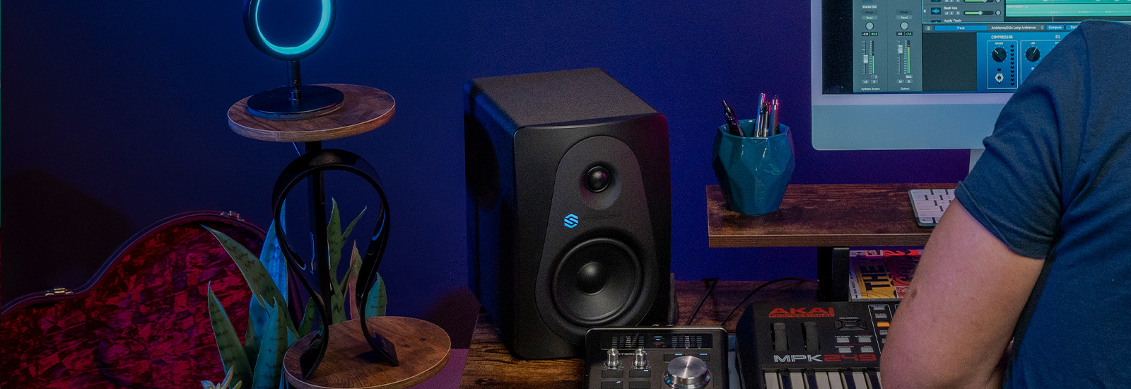 Sterling MX5 5-inch powered studio monitor in home studio.