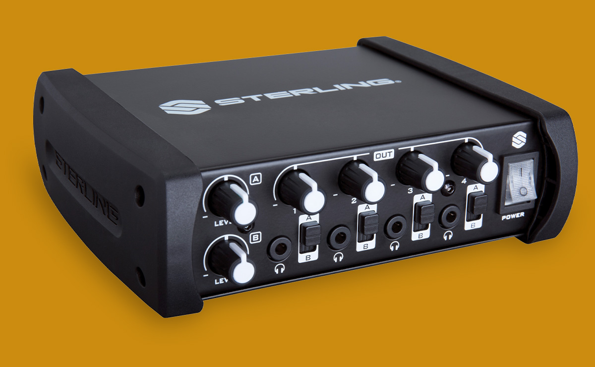 Sterling Sha4 8-channel desktop headphone amplifier angled right on yellow background.